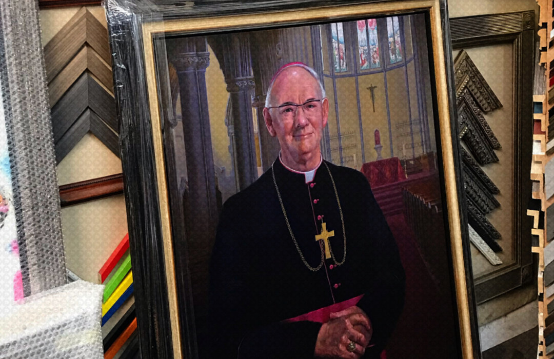A Portrait of Bishop Emery waiting for collection in the frame shop