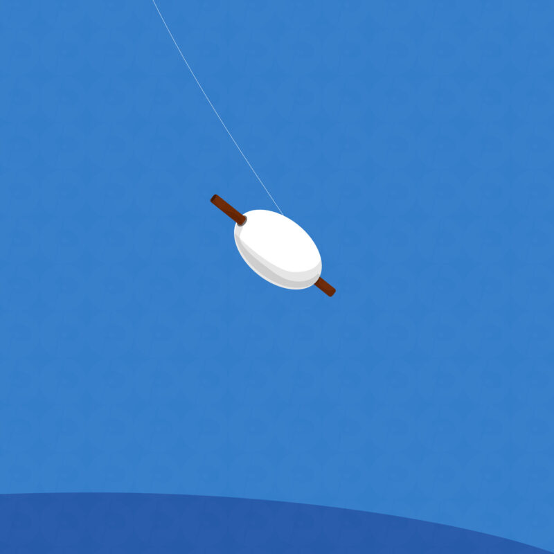 A roll of twine attached to a kite, released and gracefully soaring gently in the breeze