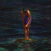 Boy standing calmly on a rock fishing with a hand-line, while surrounded by dark and sinister water